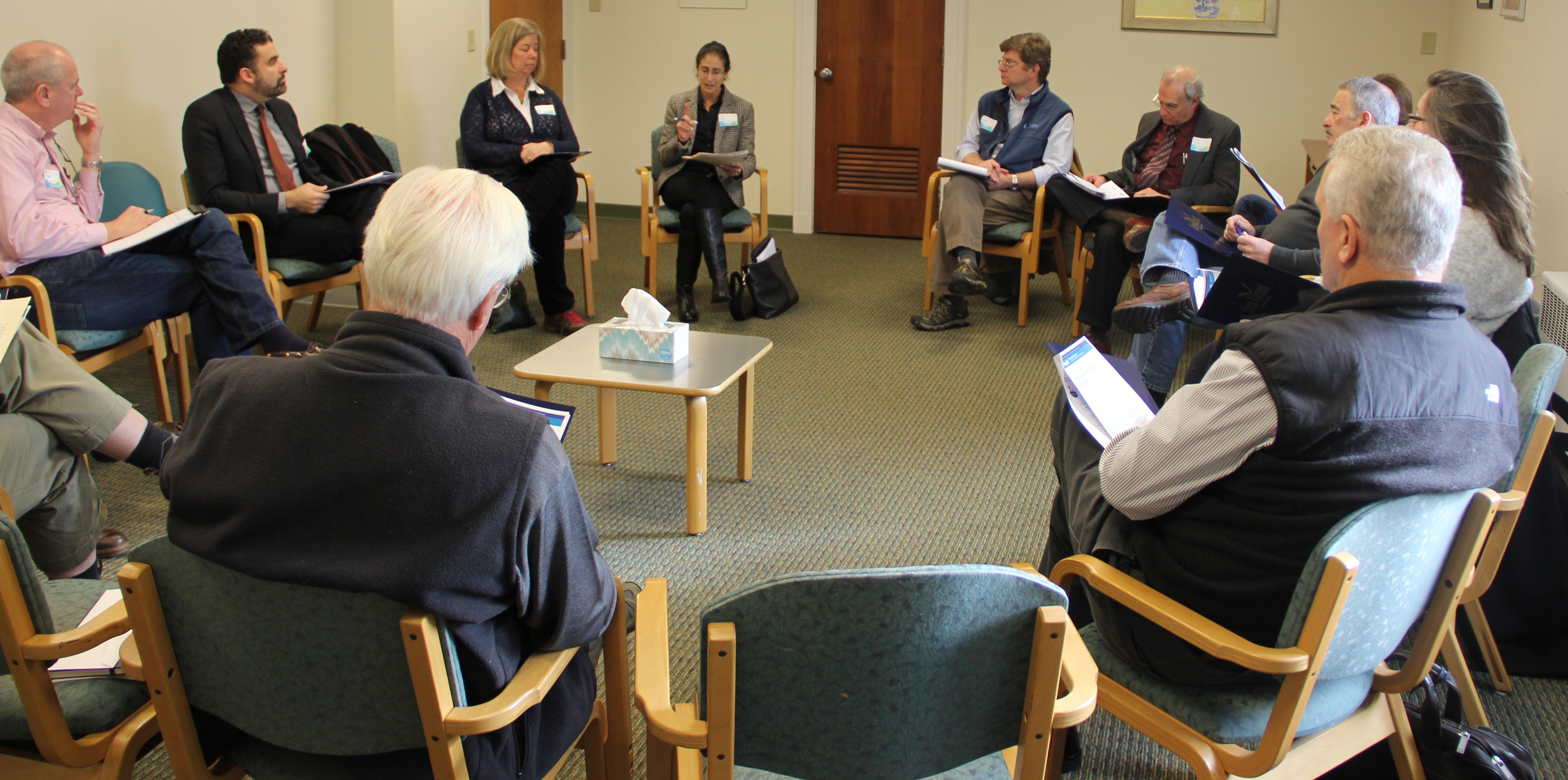 Attorney Jane Stahl, center, leads a small group discussion about flood and erosion control structures.