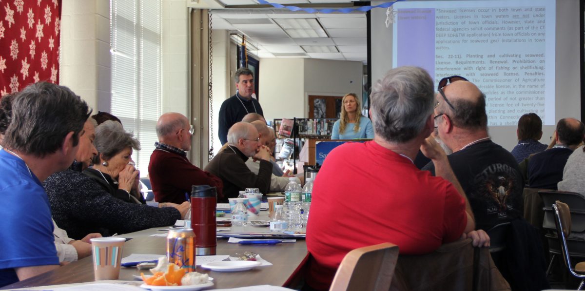 David Carey, top left, director of the state Bureau of Aquaculture, and Tessa Getchis, top center, CT Sea Grant's aquaculture extension specialist, give a presentation about a template being created for shellfish management plans during the annual meeting of the state's 18 municipal shellfish commissions.