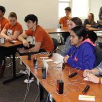 Teams from E.O. Smith High, left, and Southington compete in an early round.
