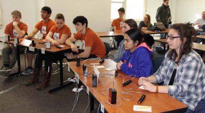 Teams from E.O. Smith High, left, and Southington compete in an early round.