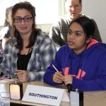 Members of the Southington High team await the next question in competition.