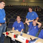 Waterford High team Coach Michael O'Connor confers with students during a break in the competition.