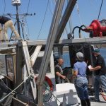 Fishermen practice an abandon ship drill aboard Michael Theiler's vessel during drill conductor training on May 11.