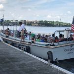 A boatload of Quest participants leaves the dock near Fort Griswold.