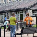 Judy Benson of Connecticut Sea Grant, right, hands out a Quest booklet at Fort Trumbull.