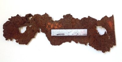 A piece of rusty metal is embedded with a photograph of the Branford beach where it was found in this work by Lilliannna Maria Baczeski.