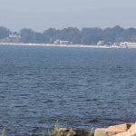 New London Harbor Light, right, is located across the mouth of the Thames River from Avery Point.