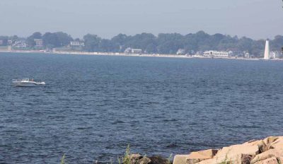 New London Harbor Light, right, is located across the mouth of the Thames River from Avery Point.