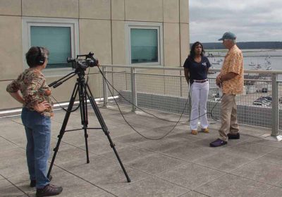 Anoushka Concepcion, aquaculture extension specialist, talks about kelp farming in Long Island Sound to "Community Buzz" host Peter Roper as Terri Roper films the interview.
