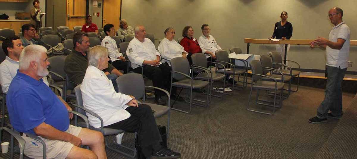 Robert Granfield, right, describes his experiences growing kelp at a site in Milford to Connecticut chefs.