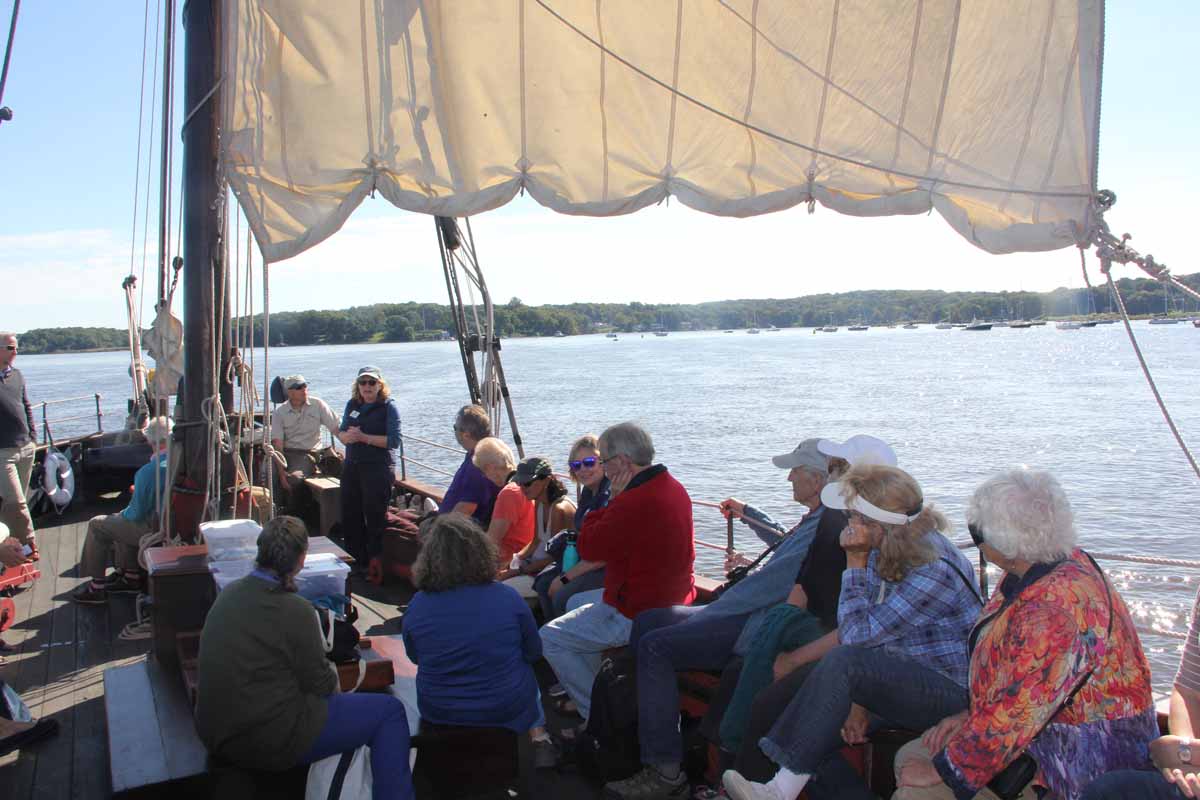 CT Sea Grant Associate Director Nancy Balcom, standing in the center, welcomes passengers to the on-the-water workshop.