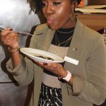 Juliet Wong, convention services manager at the Sheraton, samples one of the kelp dishes.