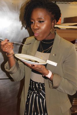 Juliet Wong, convention services manager at the Sheraton, samples one of the kelp dishes.