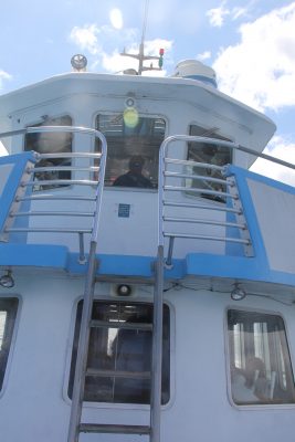 Capt. Morrison steered the boat as far east as Stonington harbor then passed by the mouth of the Mystic River, Bluff Point and other areas relevant to the speakers' talks during the trip back.