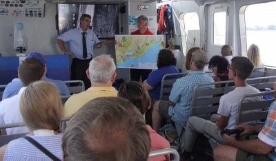 State Bureau of Aquaculture Director David Carey, left, talked about commercial aquaculture as Connecticut Sea Grant Director Sylvain De Guise holds a map showing the shellfishing areas in Norwalk harbor.