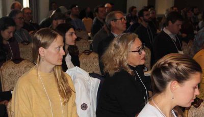 Dawn Kotowicz, left, of Rhode Island Sea Grant, and Diane Boratyn, right, owner of the Seattle-based SOLSEA Ltd. cosmetics company, listen to one of the presentations.
