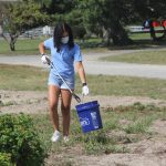 Sophia Garcia of Scarsdale, N.Y., a Maritime Aquarium volunteer, picks up a plastic bottle during the cleanup.