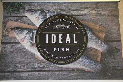 The company's logo hangs in the entryway to its indoor aquaculture farm in Waterbury.