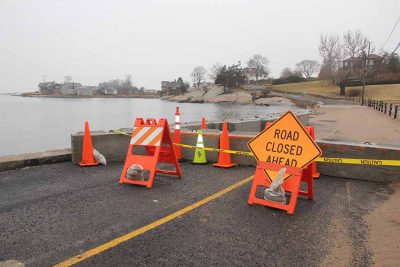 Falcon Road in Guilford, CT, was closed for more than six months in 2019 after flooding from several storms and underwent a major reconstruction. Many coastal towns are facing decisions about whether to and how to make costly repairs on frequently flooded roads or abandon them, and the legal ramifications of these decisions.