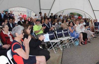 The audience of about 75 gathered for the event applauds after one of the speakers remarks.