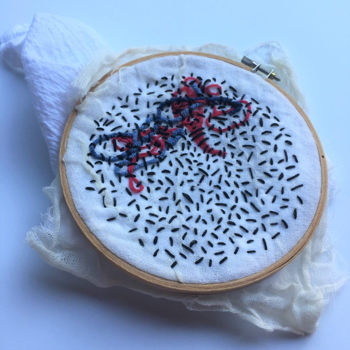 A harmful algal bloom is depicted in embroidery in one of Marsh Borden's works.
