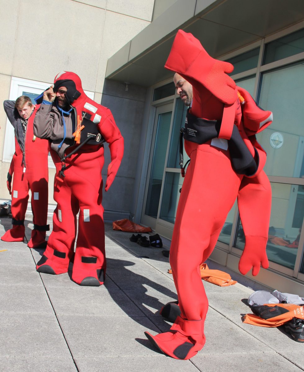 Drill conductor training students are tested on whether they can put on an immersion suite in 60 seconds or less.
