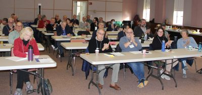 Members of the state's municipal shellfish commissions applaud after one of the presentations at the annual meeting.