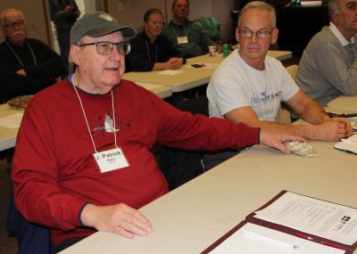 J. Patrick Kelly of the Waterford-East Lyme Shellfish Commission asks a question about shell recycling as he holds a large oyster shell.