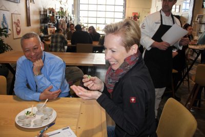 Participants in the culinary workshop sample several different types of dried seaweed.
