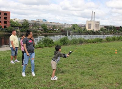 Elena Padin, left, watches as her five-year-old grandson Lucas Todd practices casting.